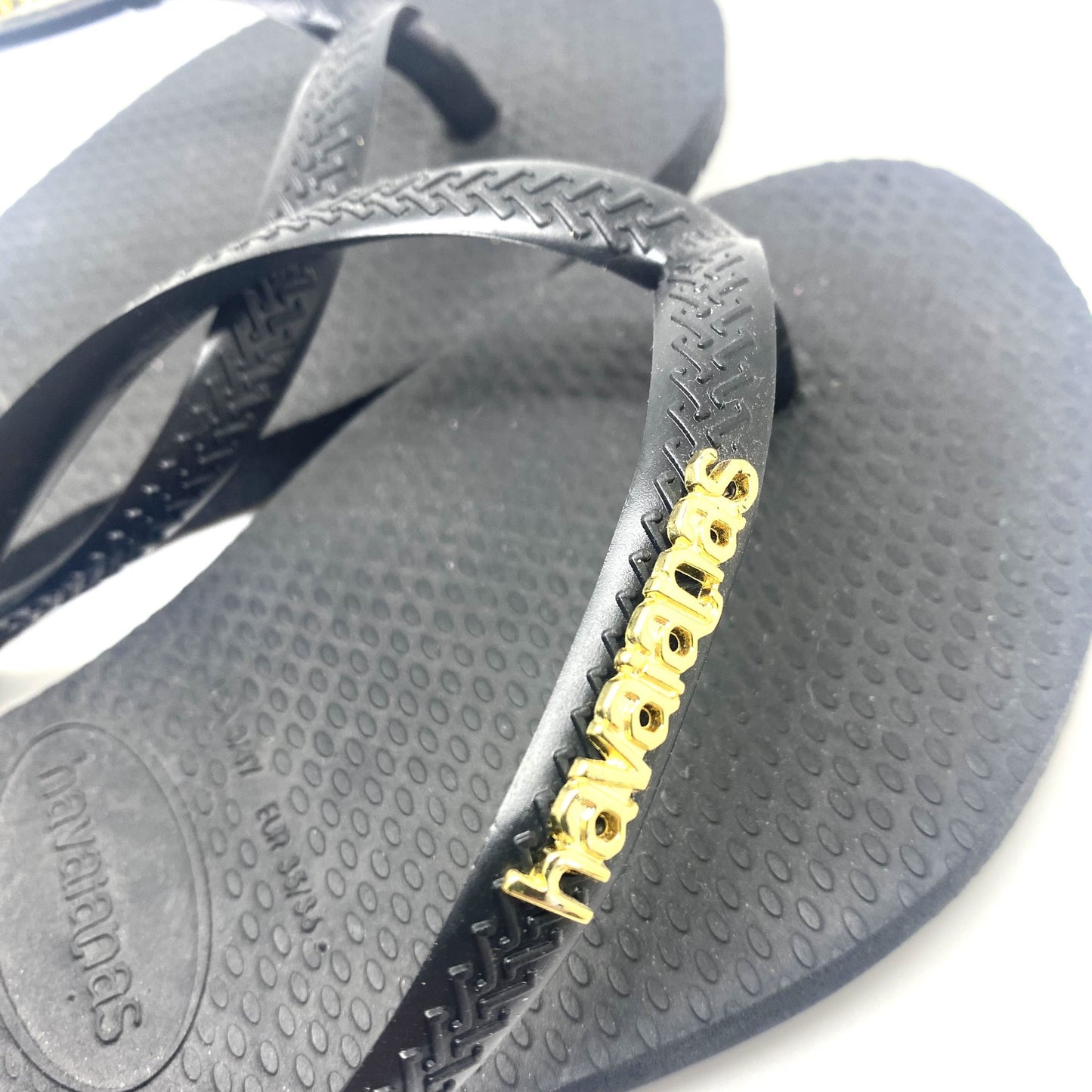 Havaianas zwart met gouden letters