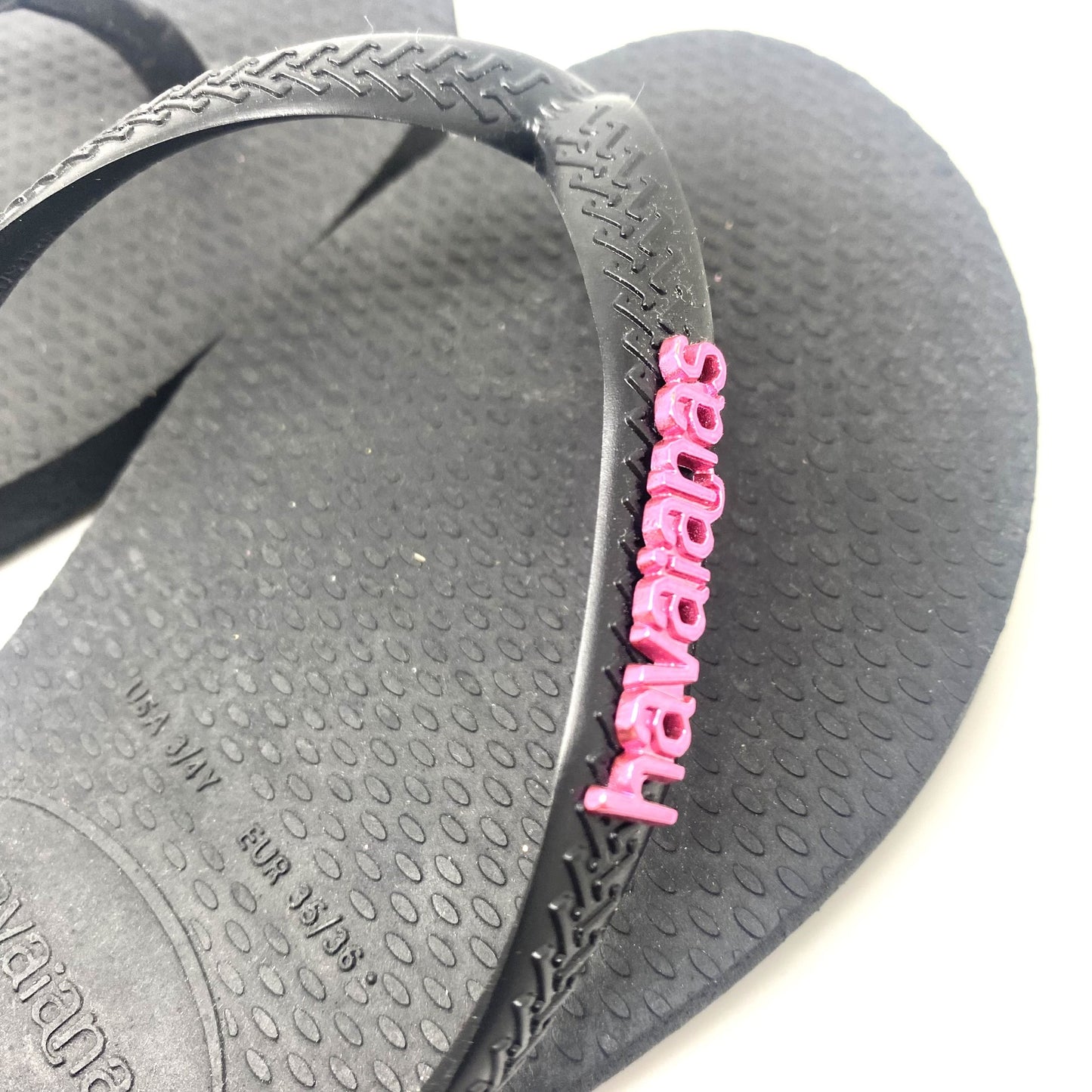 Havaianas zwart met roze letters