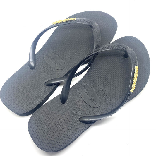 Havaianas zwart met gouden letters